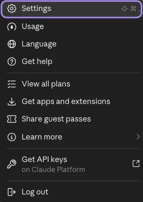 The menu behind your name in Claude, with Settings marked